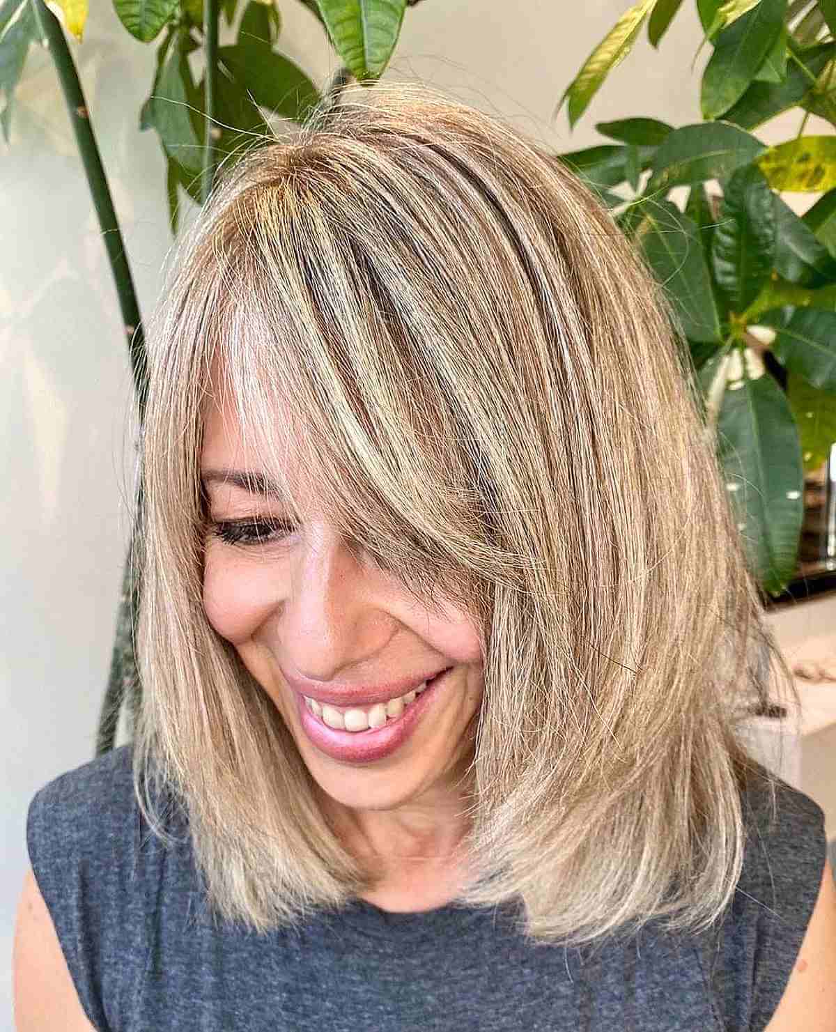 Shoulder-Length Cut with Side Bangs with Layers for Women Over 40