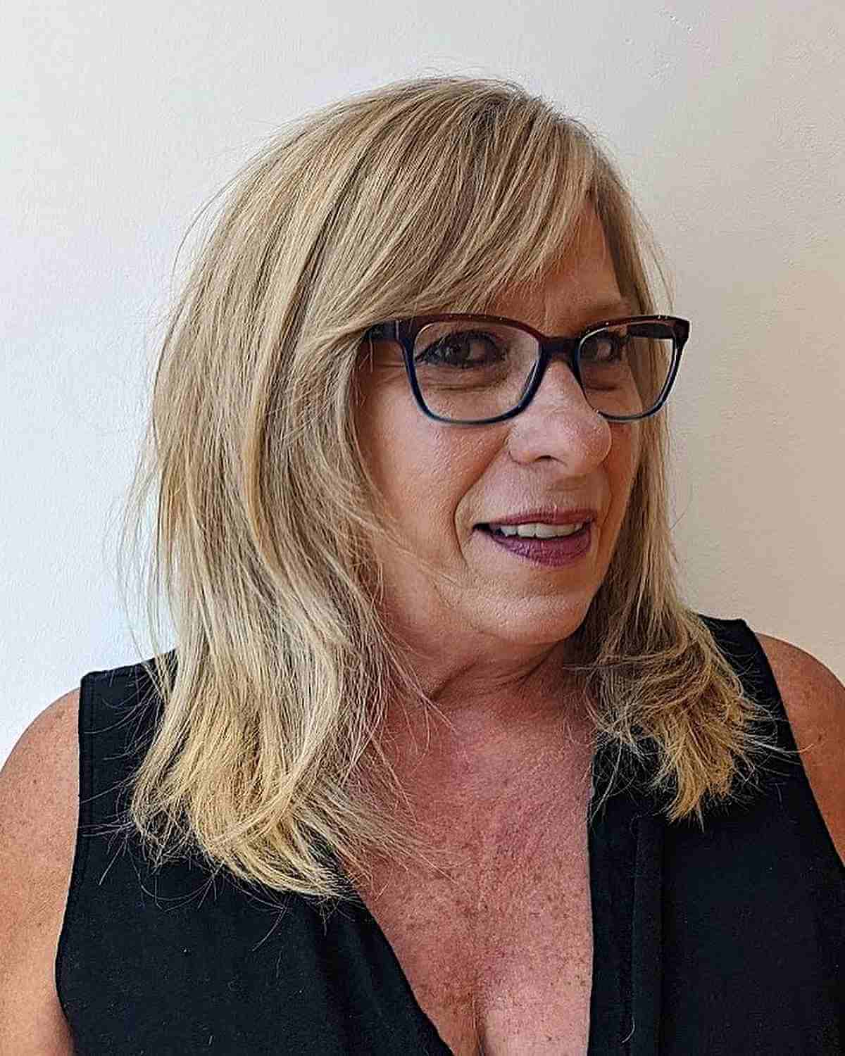Shoulder-Length Face-Framing Layers and Side Bangs for Women Over 60