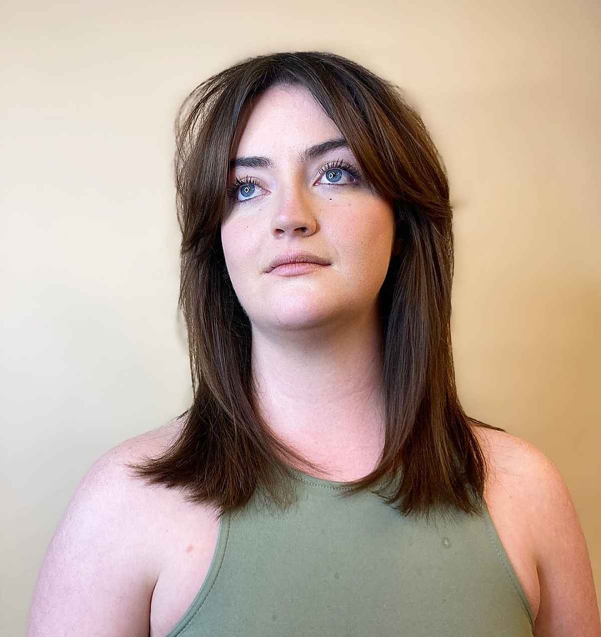 Shoulder-Length Straight Hair with Curtain Bangs