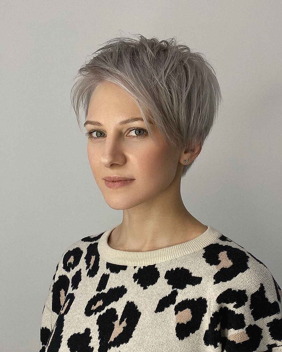 silver blonde pixie cut with long side-swept fringe