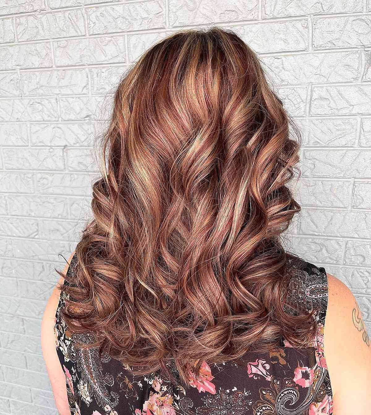 Subtle Strawberry Pink Highlights on Rose Gold Hair