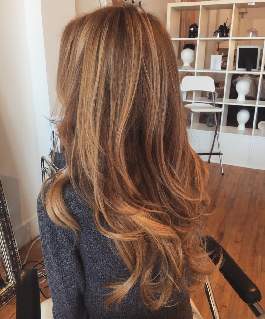 Sun-kissed Caramel Highlights for Long Layered Hair