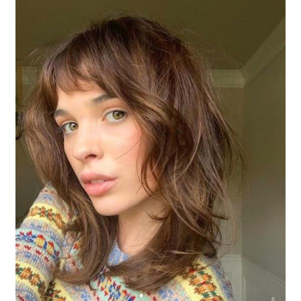 Sunkissed Brunette Medium Haircut With Short Bangs For Wavy Hair