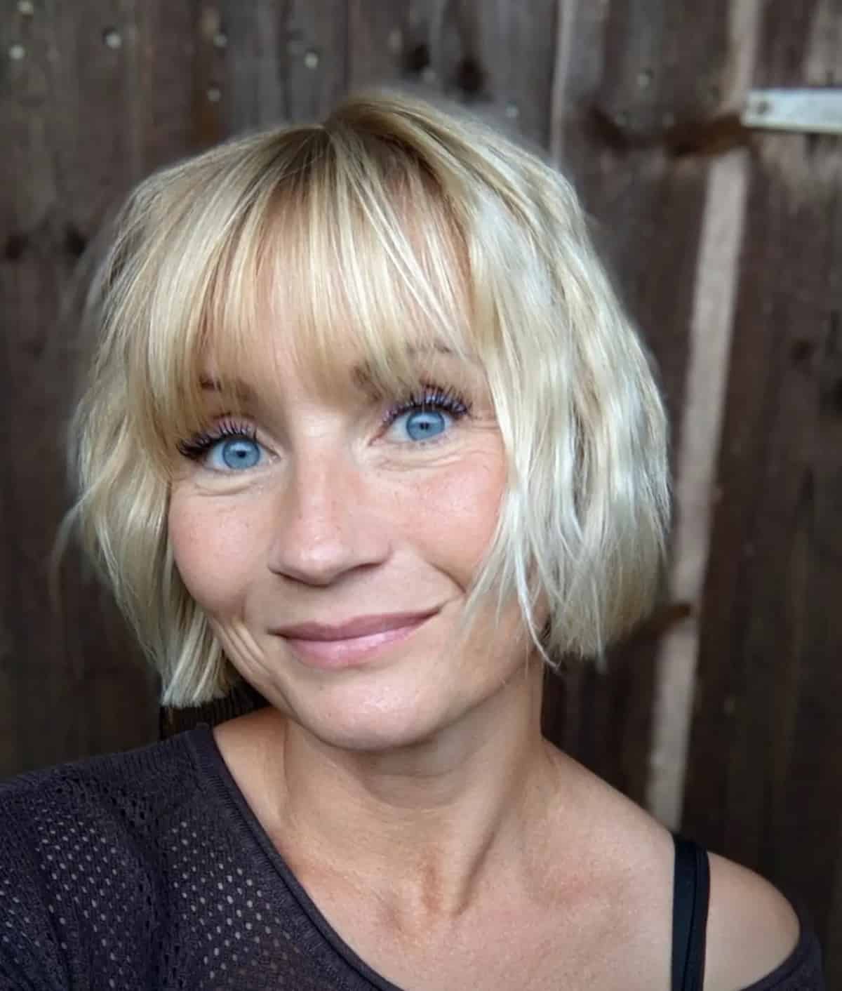 Textured blunt bob with bangs for women over 50