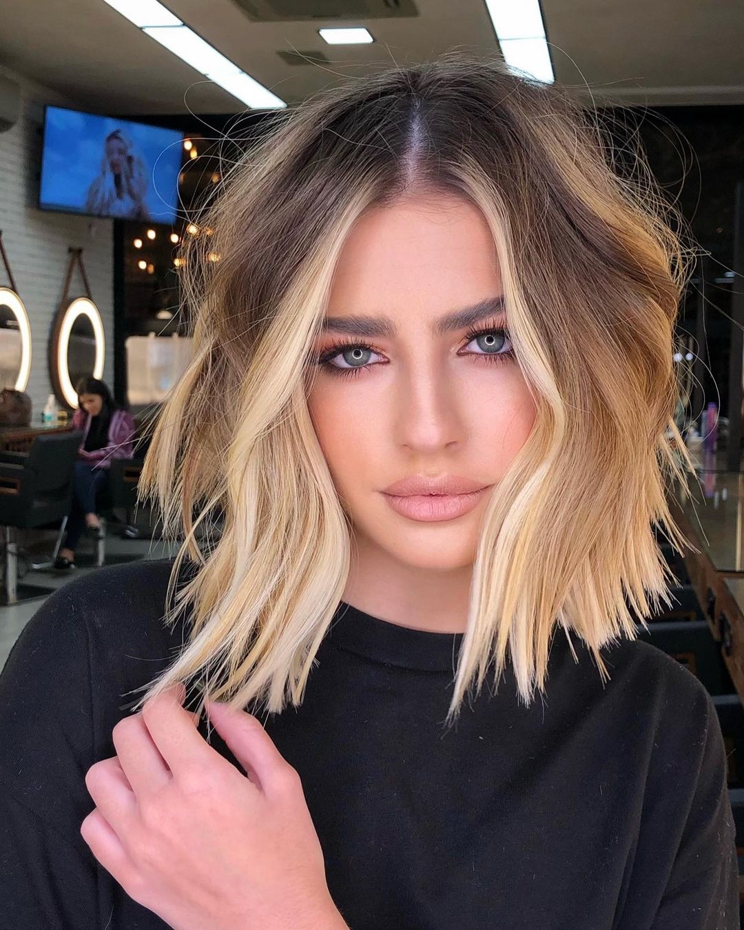 Tousled and youthful short blunt bob haircut