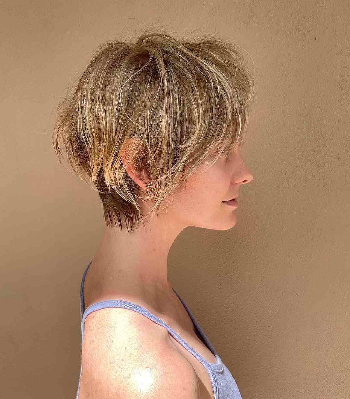 Tousled Pixie Bob with Wispy Layers That is Cut Above the Shoulders