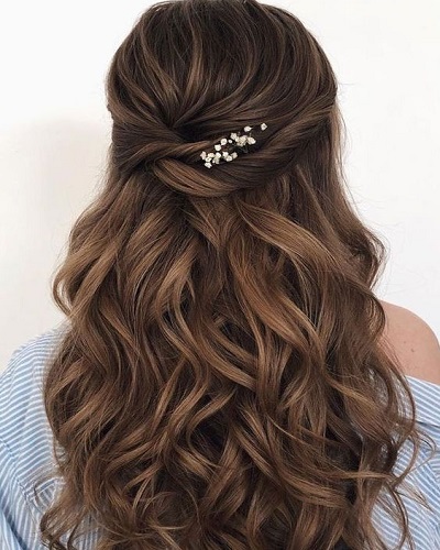 Tucked Back With Flower Detail Prom Hairstyles for Long Hair