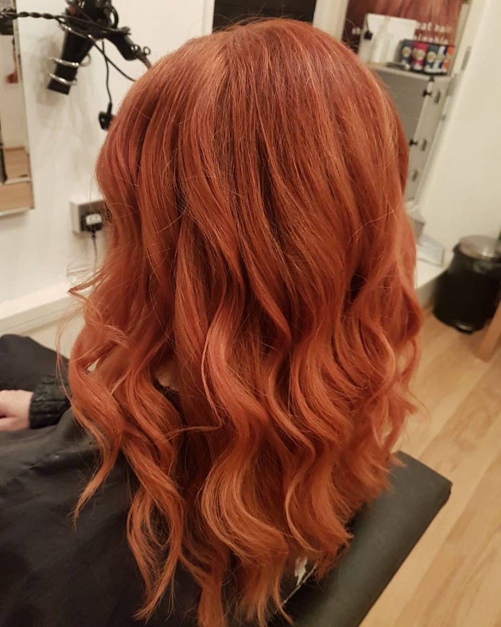 Vibrant and elegant waves with a red hair color