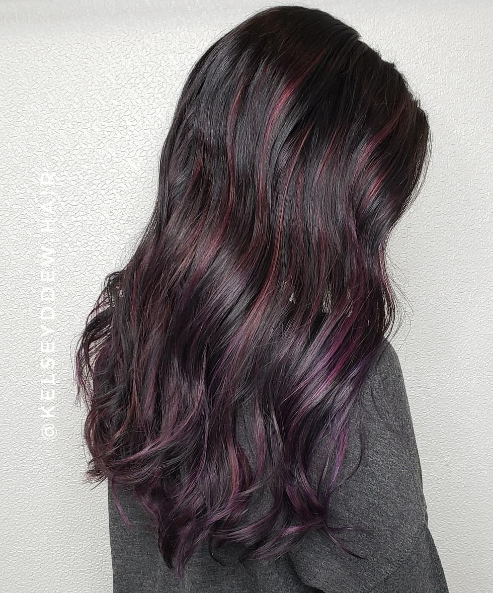 Vibrant Black Cherry Highlights on Dark Hair