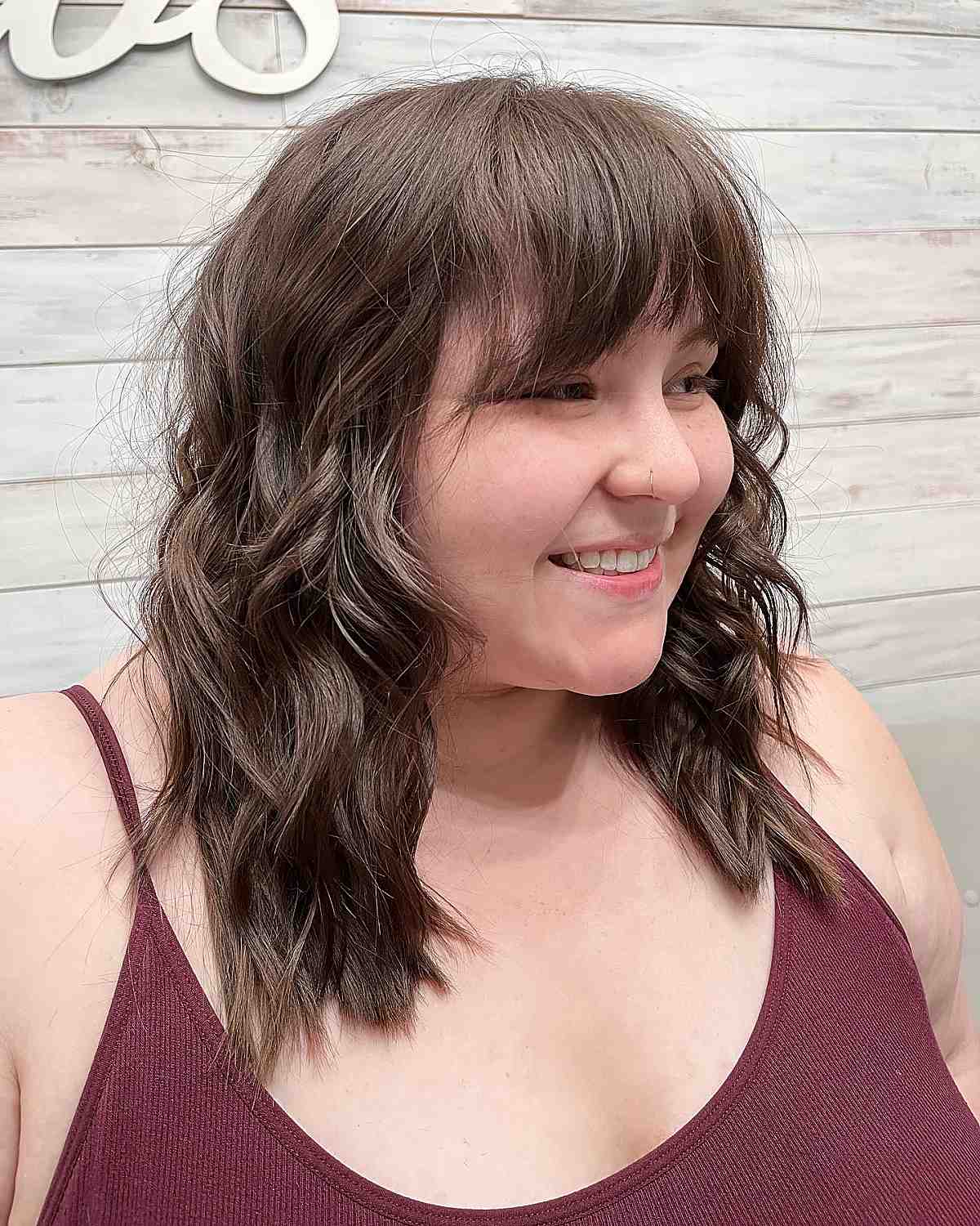 wavy long layers and textured fringe for round faces