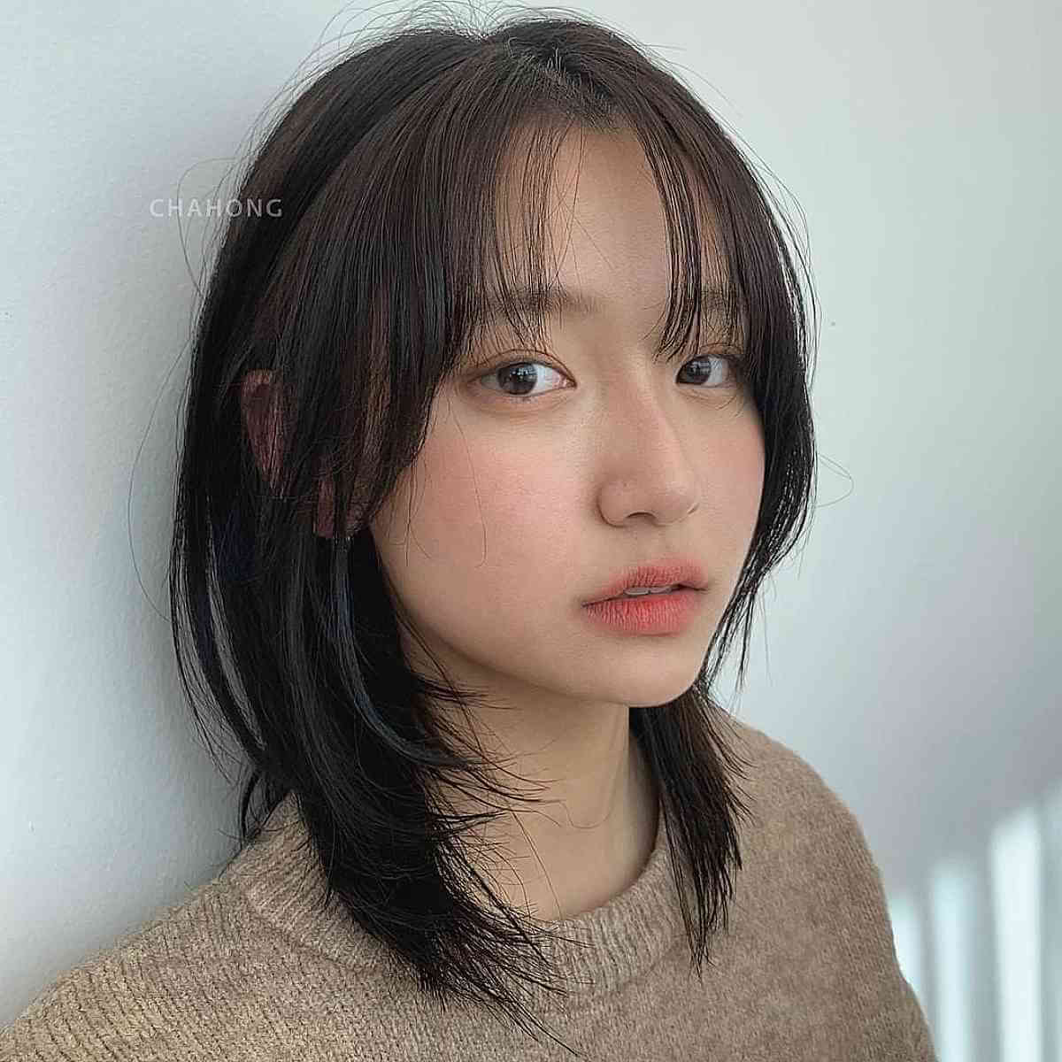 Wispy Layered Cut on Collarbone-Length Hair