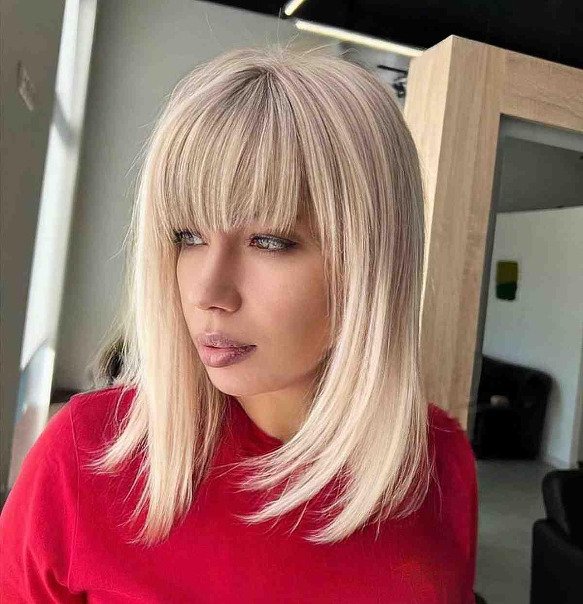Mid-Length Blonde Hair with Choppy Fringe