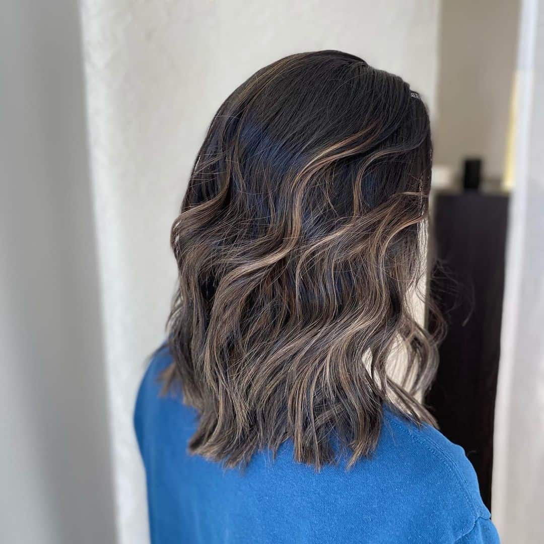 Unveiling the Beauty of Blonde Highlights on Dark Locks
