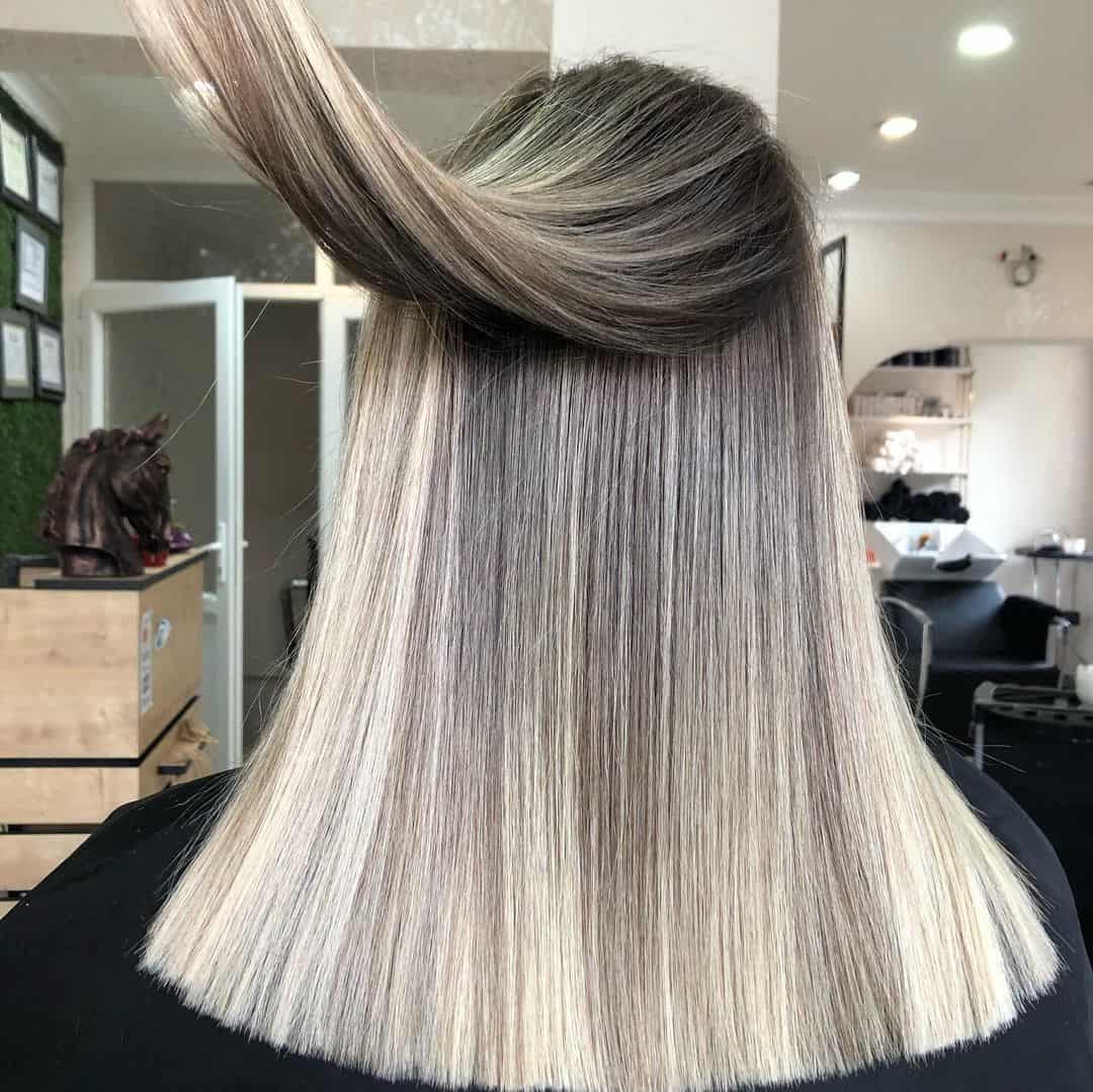 Unveiling the Beauty of Blonde Highlights on Dark Locks