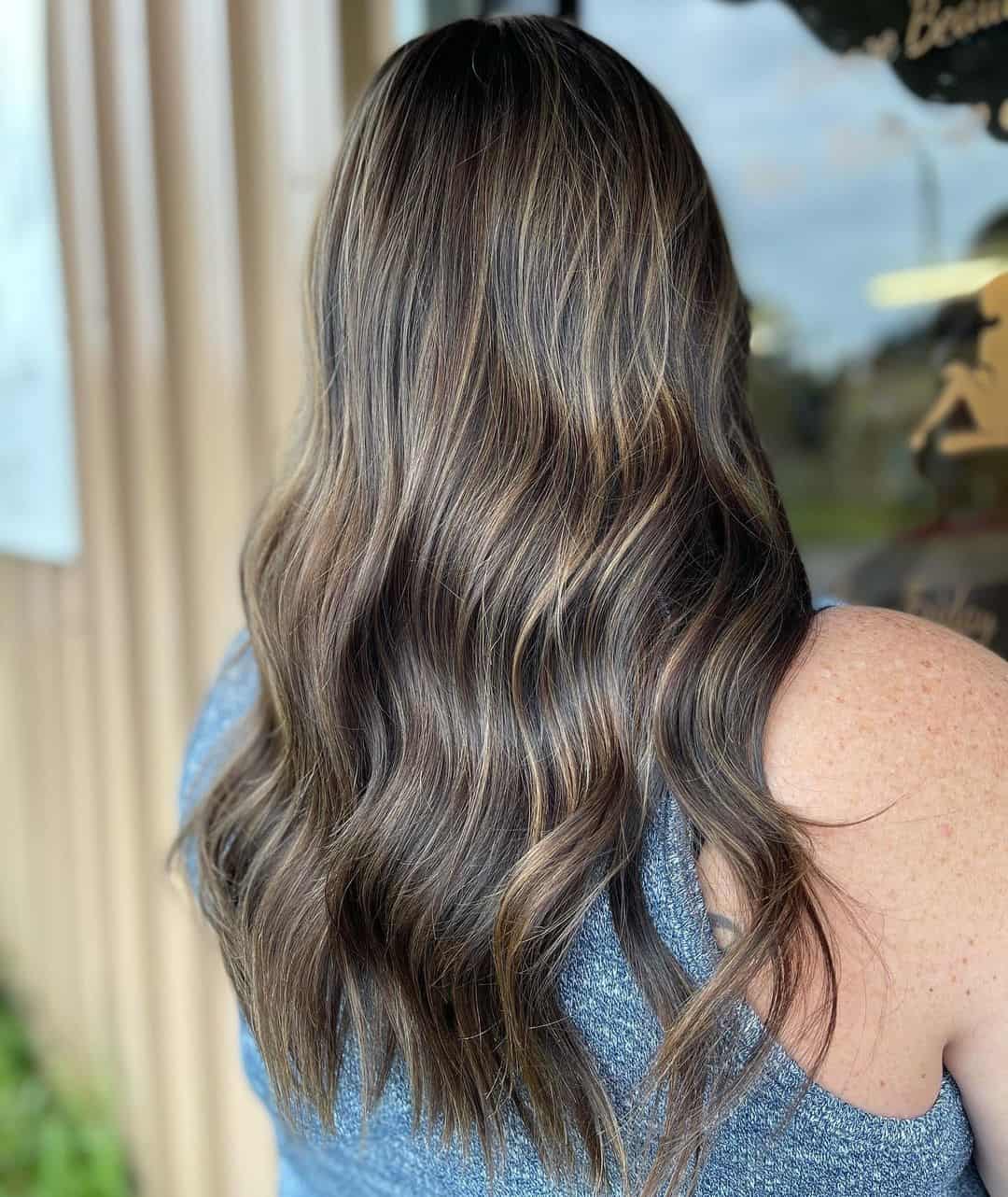 Unveiling the Beauty of Blonde Highlights on Dark Locks