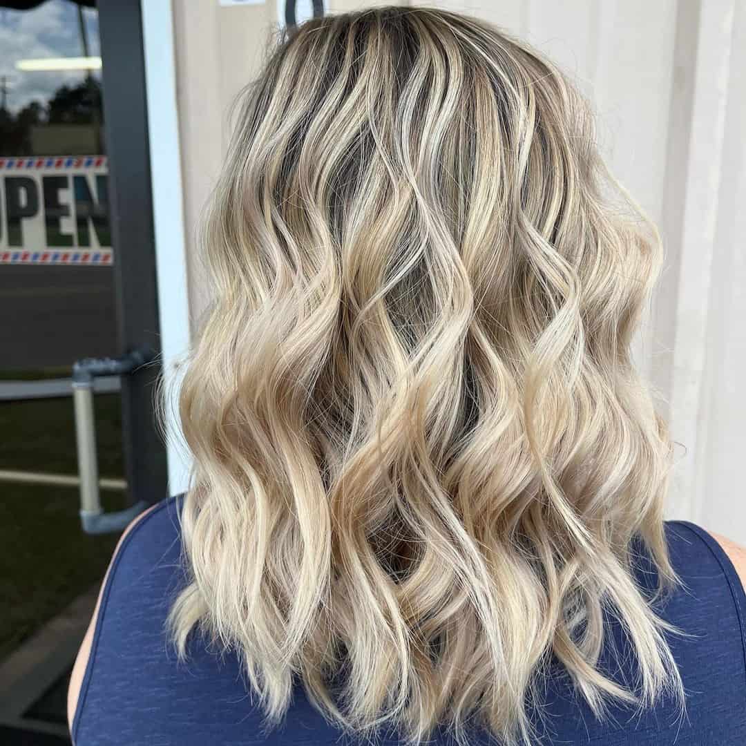 Unveiling the Beauty of Blonde Highlights on Dark Locks