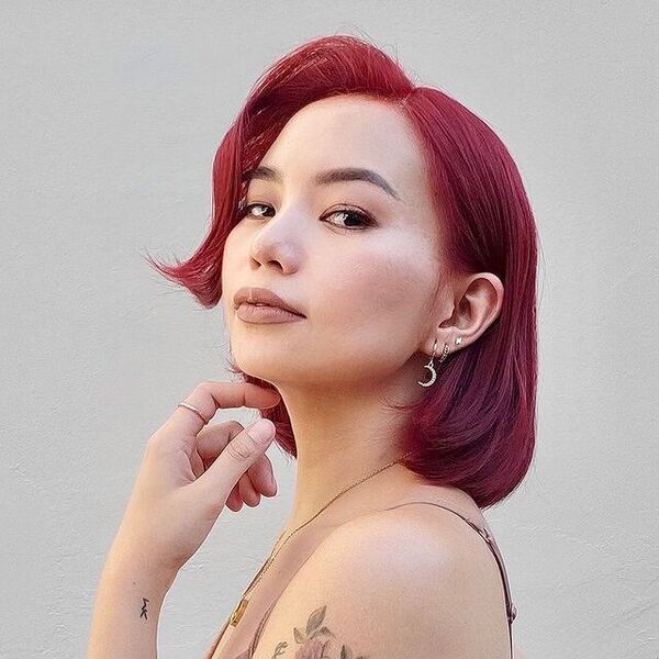 a girl wearing a moon and star earring and a necklace