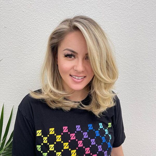 a woman wearing a black printed shirt