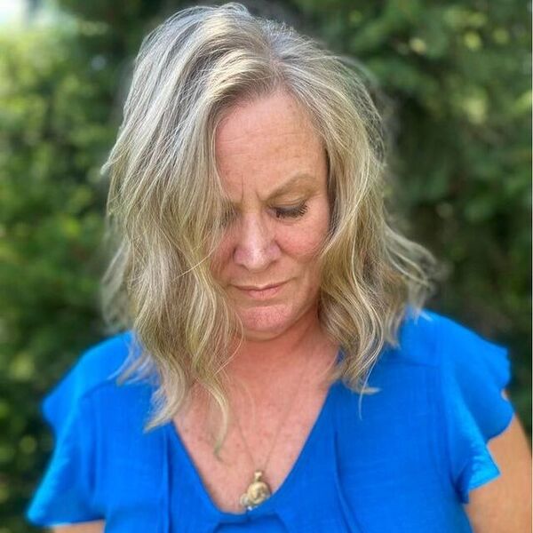 a woman wearing a blue blouse