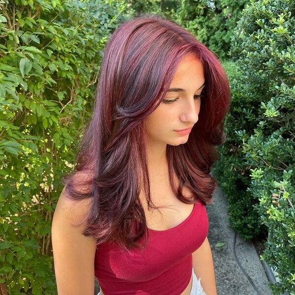 a woman wearing a red crop top