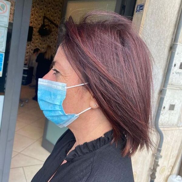 a woman wearing a surgical facemask