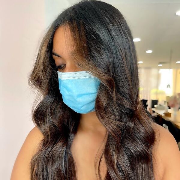 a woman wearing a surgical facemask