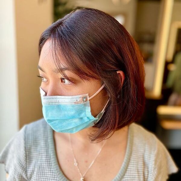 a woman wearing a surgical facemask