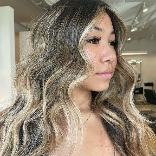 Beachy Wave Ash Blonde Balayage - a woman with freckles