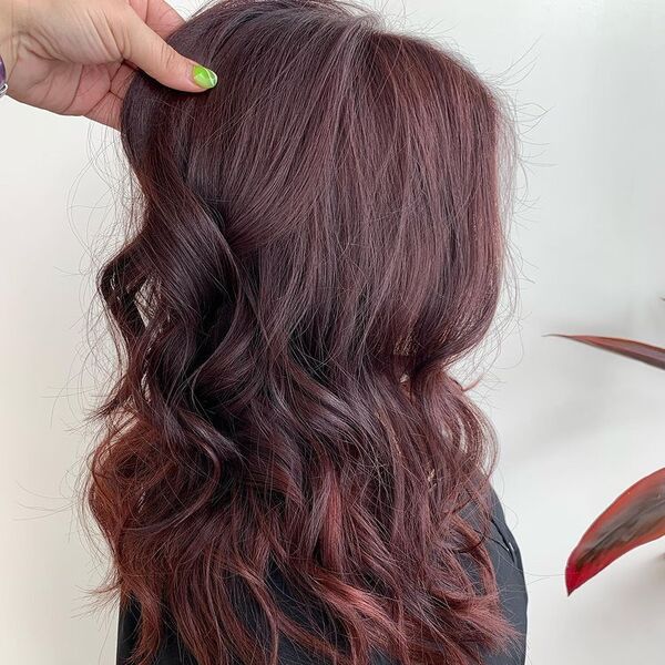 Beachy Waves Warm Brown Red Tones - a woman wearing black button down top.