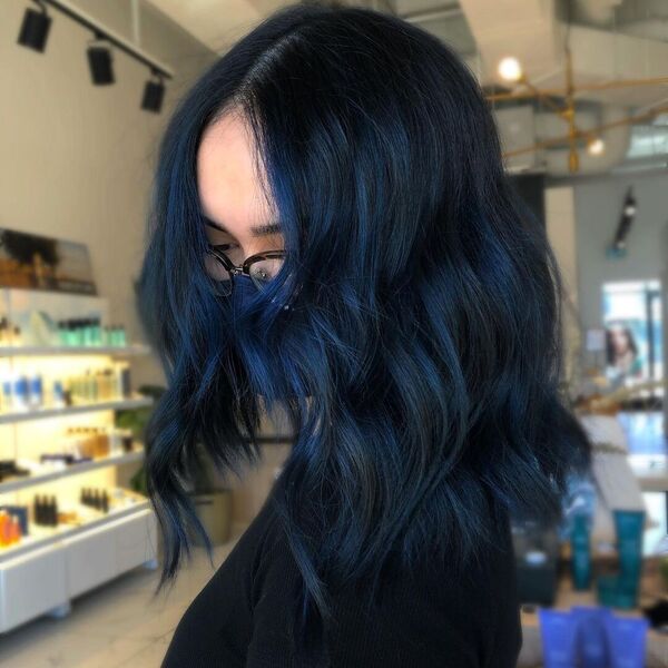 Black Blue Hair Balayage - a woman wearing a black shirt and a mask