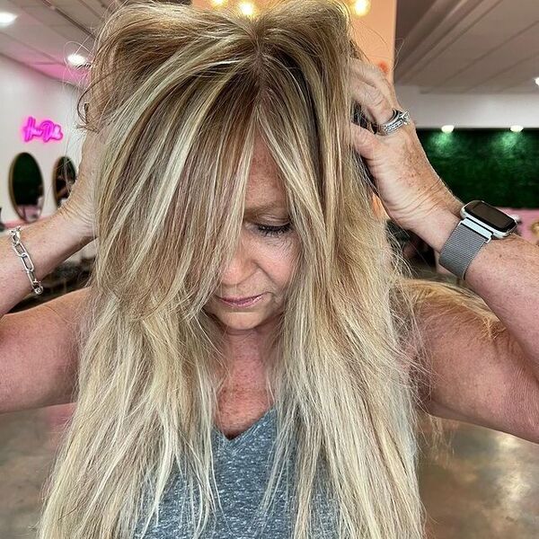 blonde highlights - a woman wearing a bracelet and watch