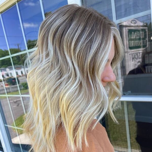 blonde highlights - a woman wearing a brown shirt