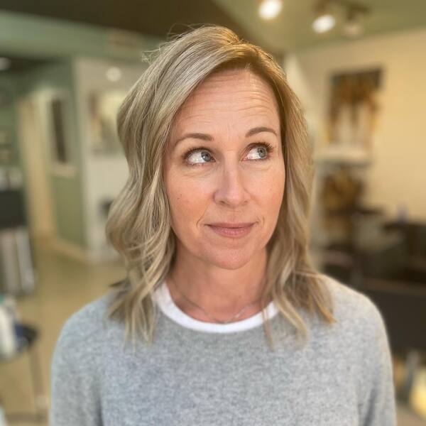 blonde highlights - a woman wearing a gray shirt