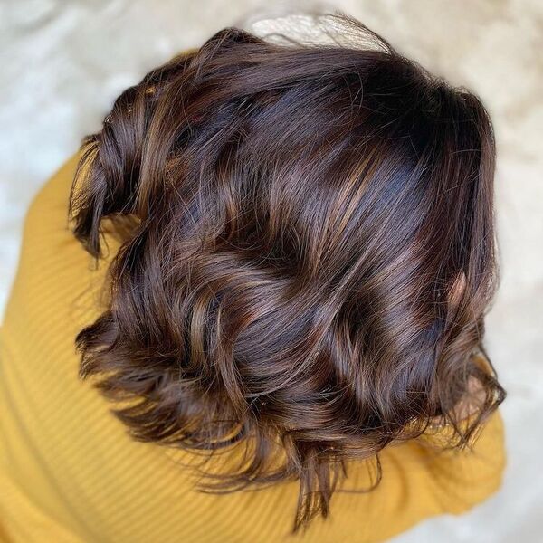 Bouncy Bob in Walnut Balayage - a woman wearing yellow long sleeves.