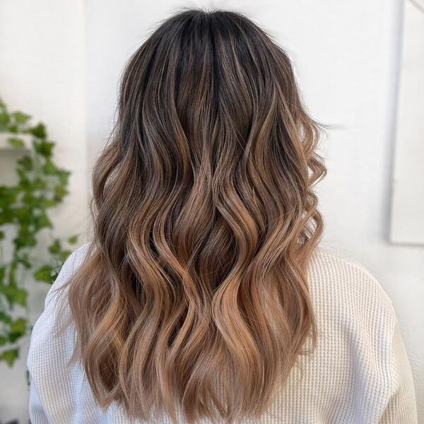 Bronde Hair Balayage - a woman wearing a white sweater