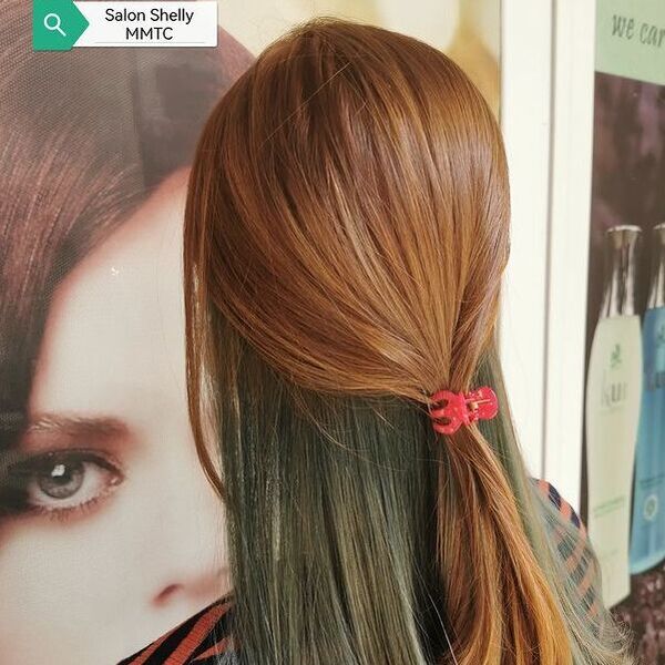 brown peekaboo hair - a girl facing the wall and has a tie on her hair