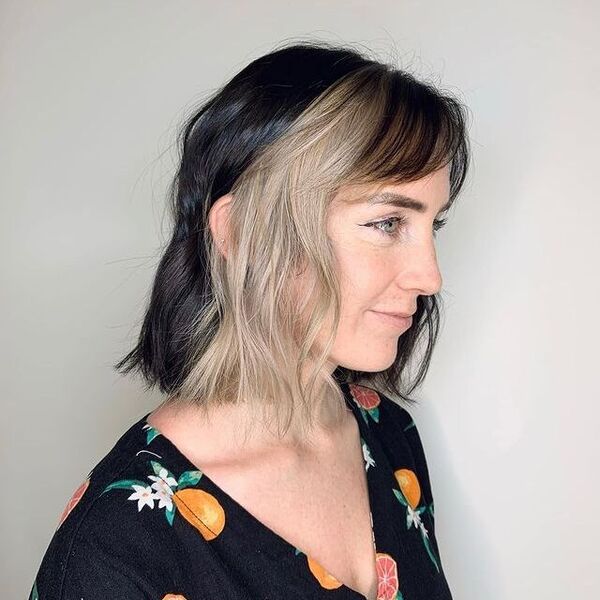 brown peekaboo hair - a girl wearing a printed black v-neck shirt