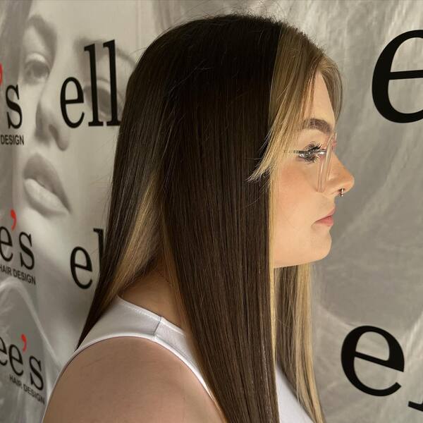 brown peekaboo hair - a girl wearing a sleeveless white shirt