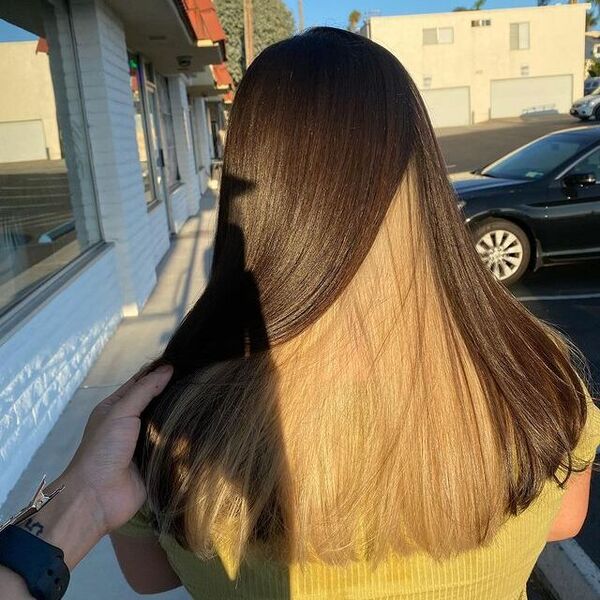 brown peekaboo hair - a girl wearing yellow shirt