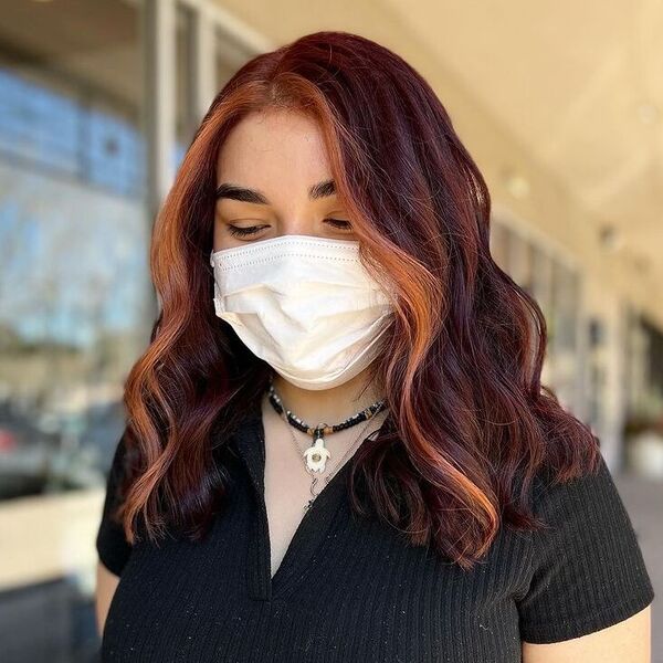 Cherry Cola hair tone on Medium Length Hair - a woman wearing white mask and black top.