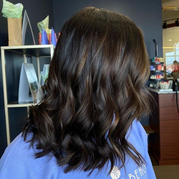 Chocolate Swirl Balayage - a woman wearing blue sweater.