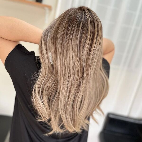 Color Melt Light Ash Brown - a woman wearing a black shirt