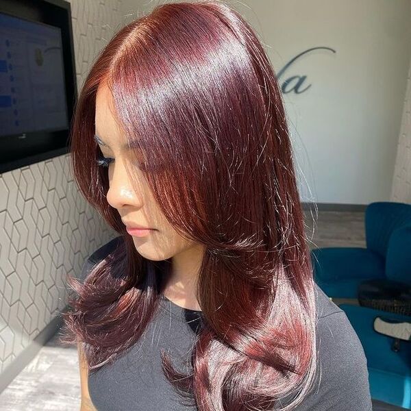 dark red hair - a girl wearing a gray round neck shirt