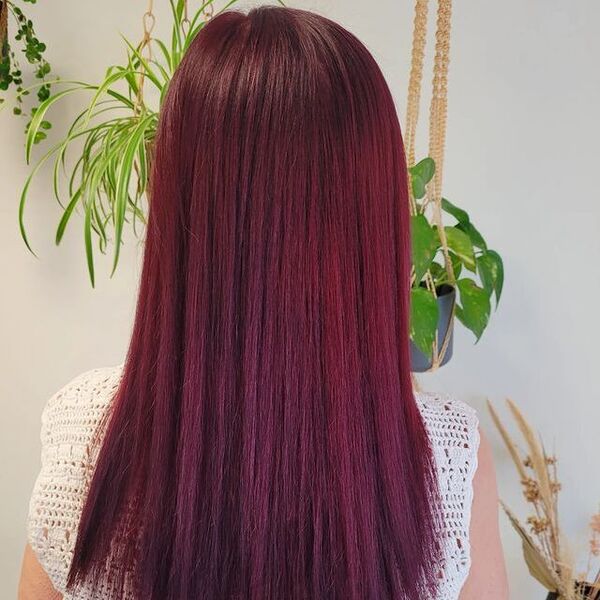 dark red hair - a girl wearing knitted sleeveless shirt