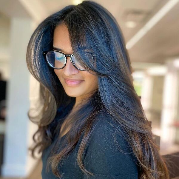 Dark Roast Balayage in Layers - a woman in black wearing glasses.