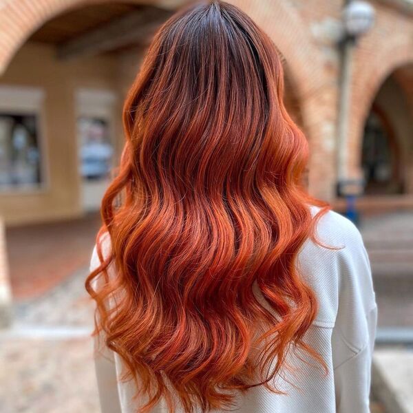 Dazzling Red Brown Weave - a woman wearing loose white long sleeves.