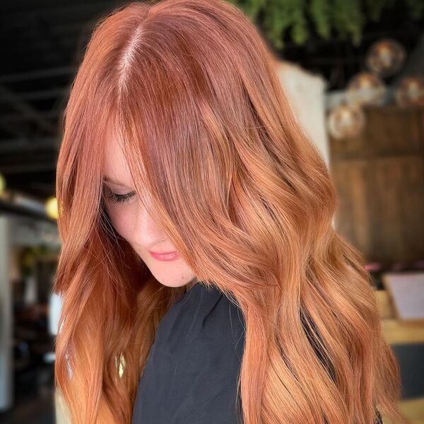 Dim Brown Blond and Red - a woman wearing black puff sleeves top.