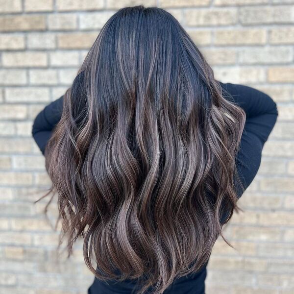 Dimensional Brunette Hair - a woman wearing a black fitted long sleeve