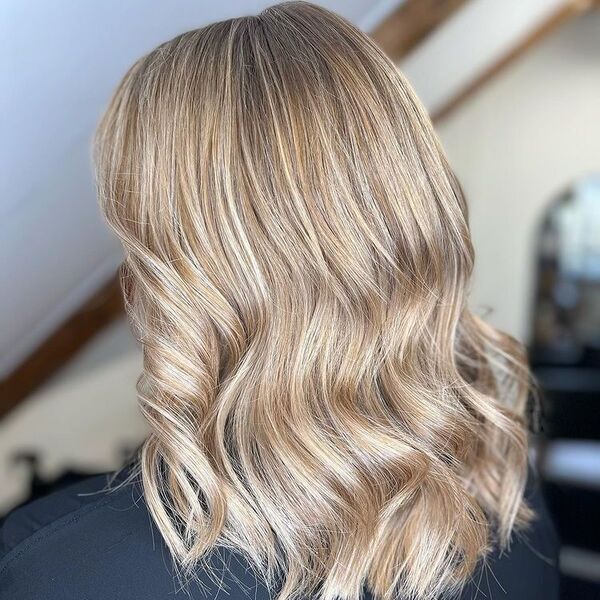 Fresh Platinum Hair with Lowlights - a woman wearing a black shirt