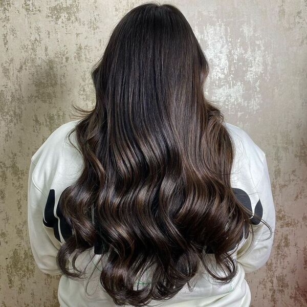 Glamourous Auburn Curl Balayage - a woman wearing white sweater.